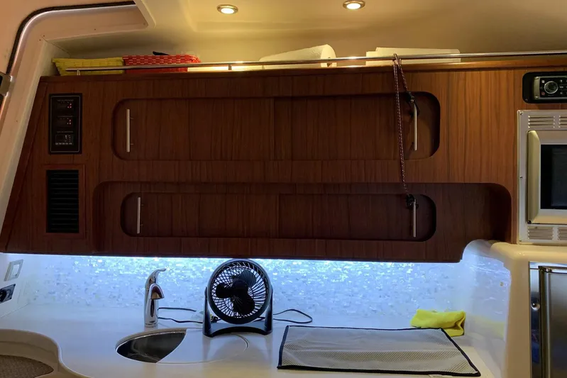  Yacht Photos Pics Interior of 2015 Grady-White Express 370 boat with wooden cabinets and modern amenities.