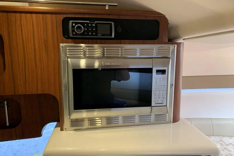  Yacht Photos Pics Microwave and stereo in 2015 Grady-White Express 370 boat interior.