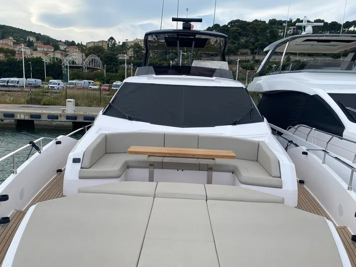 Kayra 1 Yacht Photos Pics 2024 Ferretti Yachts 780 with spacious deck seating at a marina.