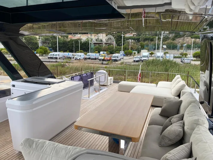 Kayra 1 Yacht Photos Pics Luxurious 2024 Ferretti Yachts 780 deck with elegant seating and scenic view.