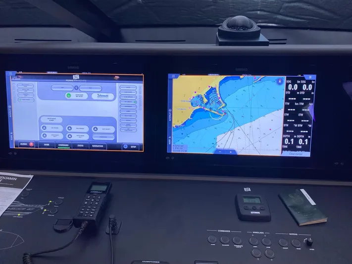 Kayra 1 Yacht Photos Pics Control panel of a 2024 Ferretti Yachts 780 with navigation screens and communication devices.