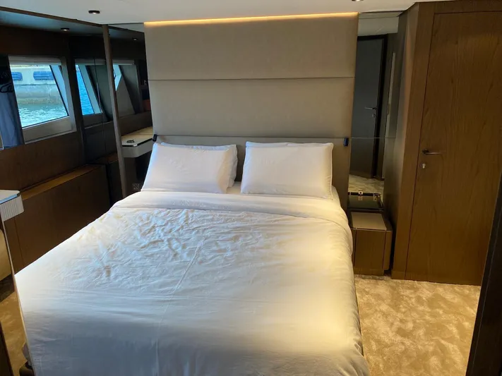 Kayra 1 Yacht Photos Pics Luxurious bedroom interior of 2024 Ferretti Yachts 780 with elegant bedding and modern design.