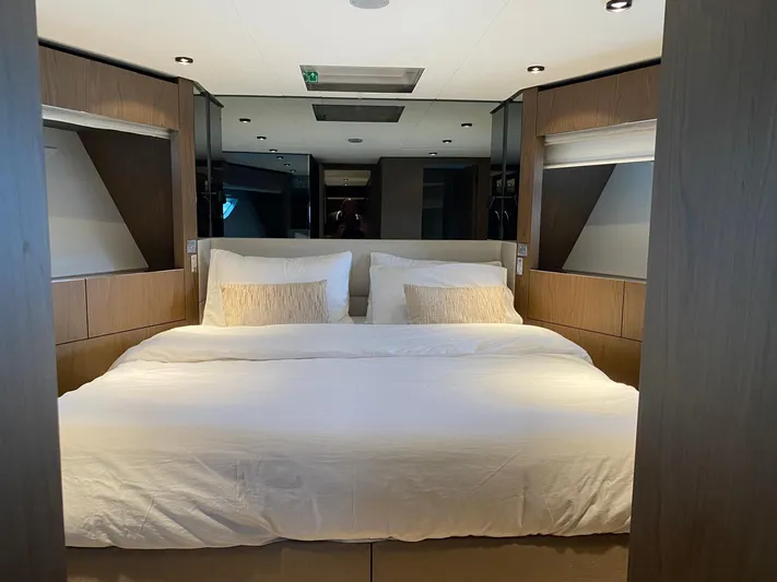 Kayra 1 Yacht Photos Pics Luxurious bedroom interior of 2024 Ferretti Yachts 780 with elegant bedding and modern design.