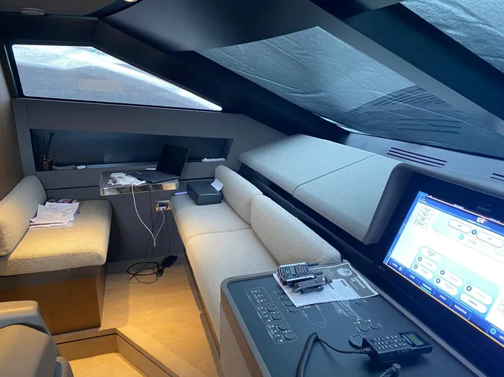 Kayra 1 Yacht Photos Pics Luxurious interior of 2024 Ferretti Yachts 780 with modern control panel and seating area.