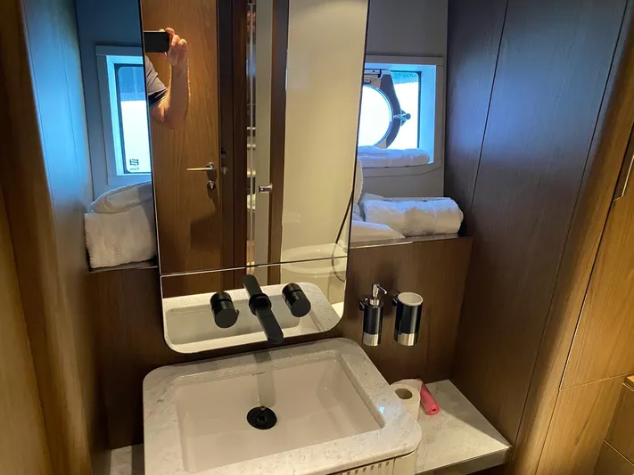Kayra 1 Yacht Photos Pics Luxurious bathroom in 2024 Ferretti Yachts 780, featuring modern sink and mirror.