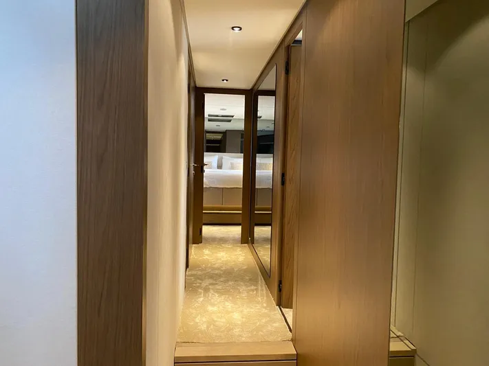 Kayra 1 Yacht Photos Pics Hallway inside 2024 Ferretti Yachts 780, featuring modern wood paneling and soft lighting.