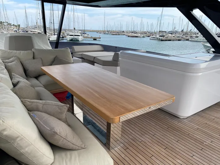 Kayra 1 Yacht Photos Pics Luxurious 2024 Ferretti Yachts 780 deck with elegant seating and marina view.