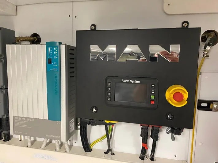 Kayra 1 Yacht Photos Pics Control panel of a 2024 Ferretti Yachts 780, featuring MAN alarm system and electrical components.