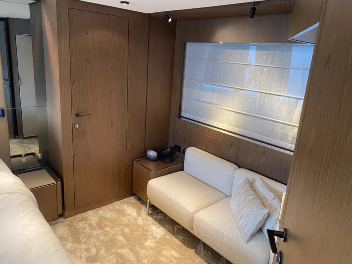 Kayra 1 Yacht Photos Pics Luxurious interior of 2024 Ferretti Yachts 780 with elegant wood paneling and cozy seating.
