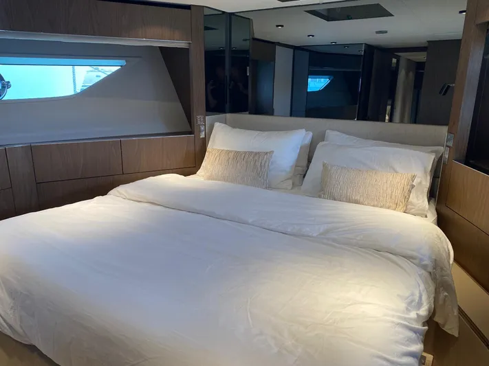 Kayra 1 Yacht Photos Pics Luxurious bedroom interior of 2024 Ferretti Yachts 780 with elegant bedding and modern design.