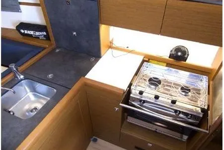  Yacht Photos Pics 2023 Jeanneau Sun Odyssey 349 Performance yacht kitchen with stove and sink.