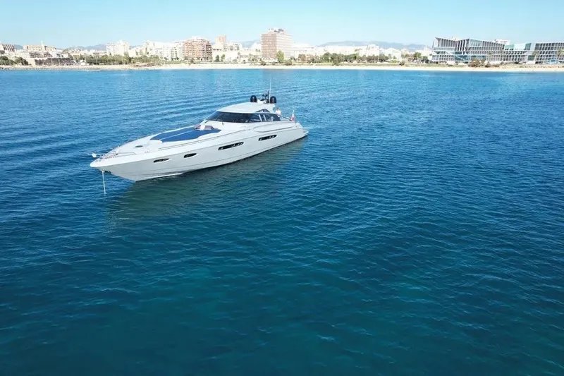  Yacht Photos Pics Luxury Baia Atlantica 78 yacht from 2005 on calm blue waters near a city shoreline.