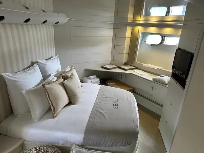  Yacht Photos Pics Luxurious cabin interior of 2005 Baia Atlantica 78 yacht with cozy bed and modern decor.