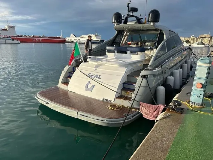  Yacht Photos Pics Luxury yacht Baia Atlantica 78, 2005 model, docked at a marina with scenic backdrop.