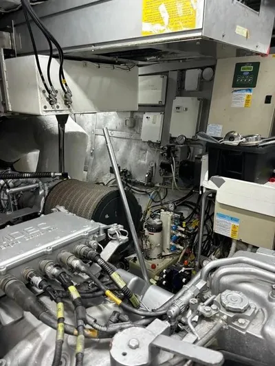 Yacht Photos Pics Engine room of a 2005 Baia Atlantica 78 yacht, showcasing complex machinery and wiring.
