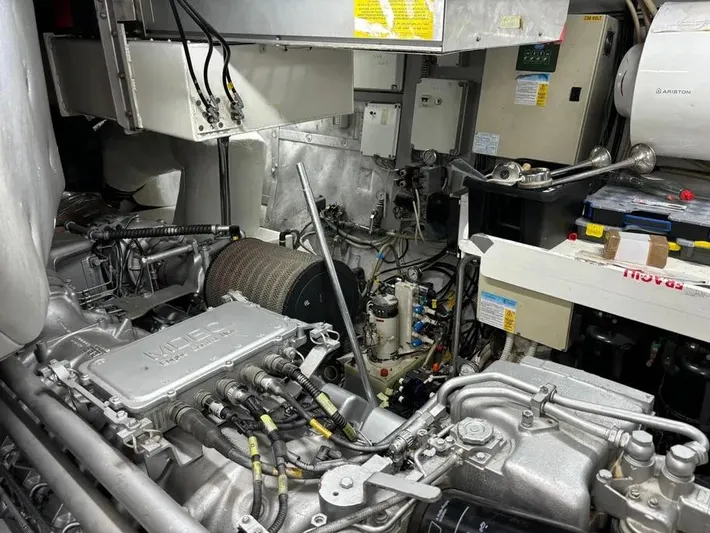  Yacht Photos Pics Engine room of a 2005 Baia Atlantica 78 yacht, showcasing mechanical components and wiring.