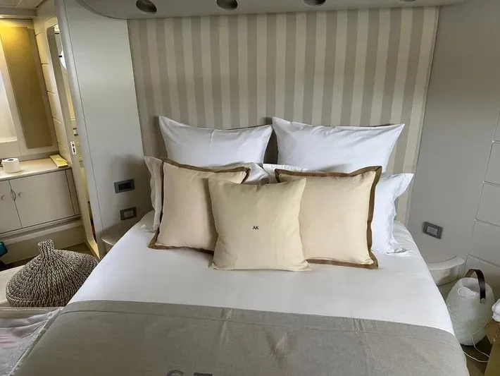  Yacht Photos Pics Luxurious bedroom interior on a 2005 Baia Atlantica 78 yacht, featuring elegant bedding and decor.