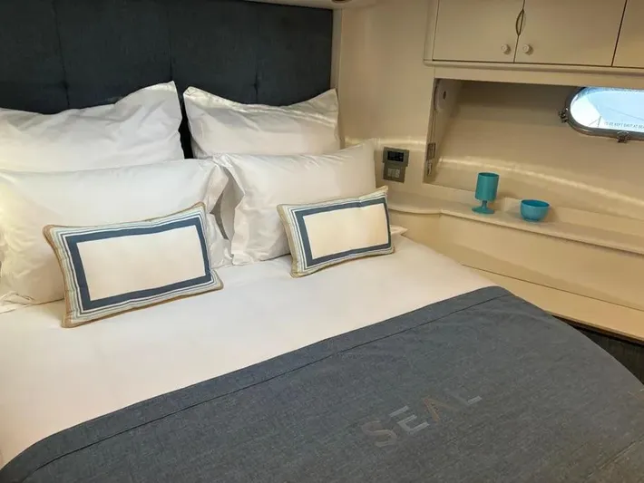  Yacht Photos Pics Luxurious bedroom interior of 2005 Baia Atlantica 78 yacht with elegant bedding and decor.