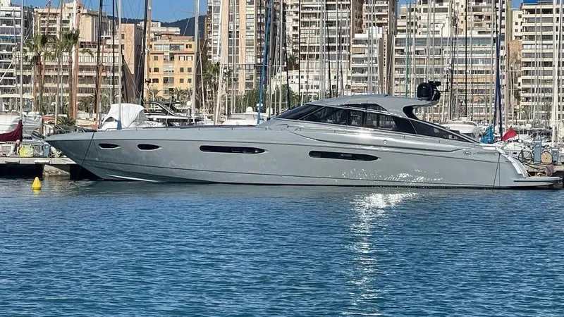  Yacht Photos Pics Luxury 2005 Baia Atlantica 78 yacht docked in a marina, surrounded by cityscape.