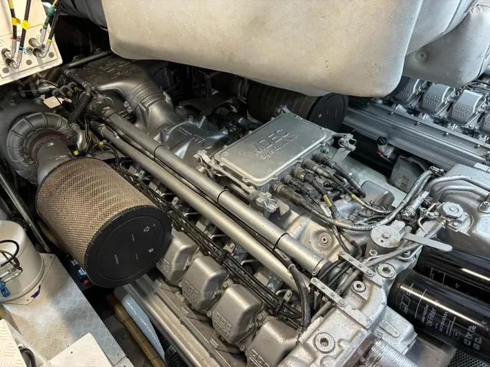  Yacht Photos Pics Engine compartment of a 2005 Baia Atlantica 78 yacht, showcasing detailed mechanical components.