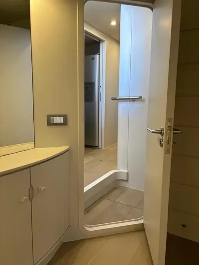  Yacht Photos Pics Interior of 2005 Baia Atlantica 78 yacht, featuring a modern doorway and cabinetry.