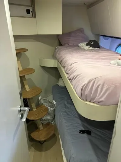  Yacht Photos Pics Compact cabin with bunk beds and wooden steps in a 2005 Baia Atlantica 78 yacht.