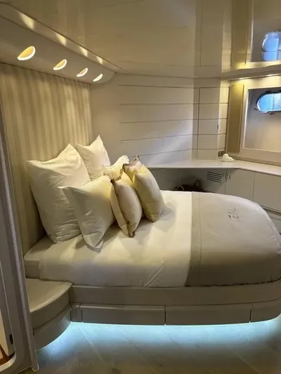  Yacht Photos Pics Luxurious cabin interior of 2005 Baia Atlantica 78 yacht with elegant bedding and ambient lighting.