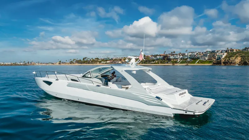 Catch And Release Yacht Photos Pics Luxurious 2017 Triton Custom yacht cruising on a sunny day near the coastline.