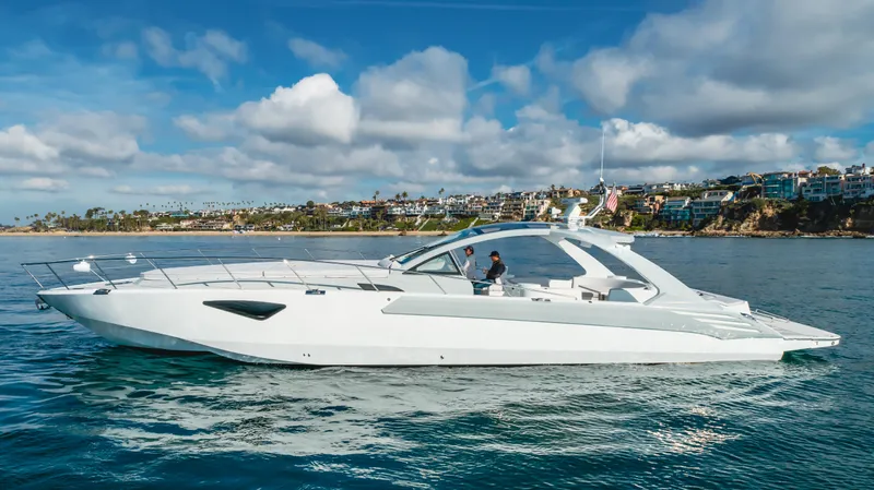 Catch And Release Yacht Photos Pics Luxurious 2017 Triton Custom yacht cruising on calm waters under a partly cloudy sky.