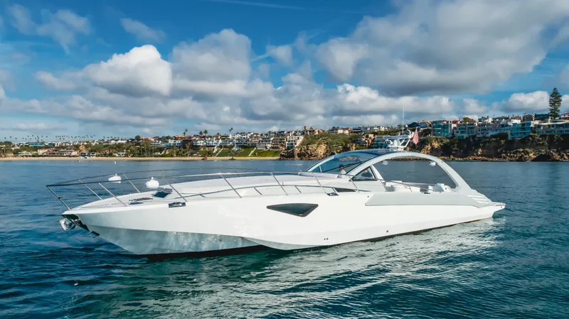 Catch And Release Yacht Photos Pics Luxurious 2017 Triton Custom yacht cruising on a sunny day near coastal town.