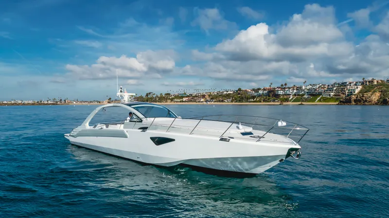 Catch And Release Yacht Photos Pics Luxurious 2017 Triton Custom yacht cruising on a sunny day near the coastline.