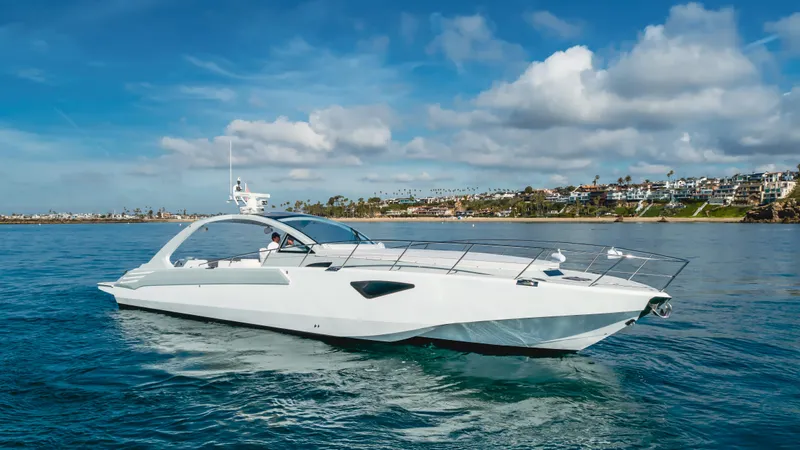 Catch And Release Yacht Photos Pics Luxurious 2017 Triton Custom yacht cruising on a sunny day with scenic coastal backdrop.