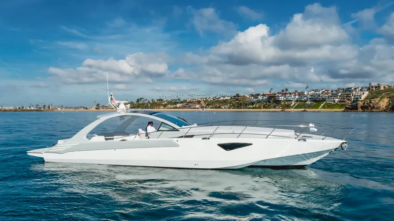 Catch And Release Yacht Photos Pics 2017 Triton Custom yacht cruising on a sunny day with coastal view.