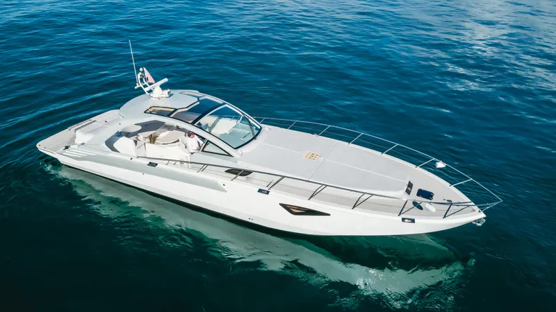 Catch And Release Yacht Photos Pics Luxurious 2017 Triton Custom yacht cruising on clear blue ocean waters.