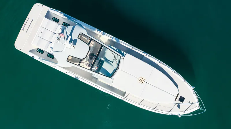 Catch And Release Yacht Photos Pics Aerial view of 2017 Triton Custom boat on clear blue water.