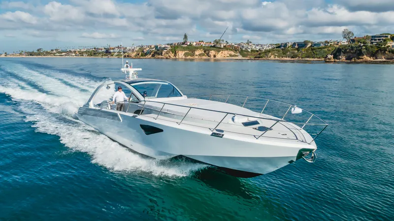 Catch And Release Yacht Photos Pics Luxurious 2017 Triton Custom yacht cruising on clear blue water near scenic coastline.