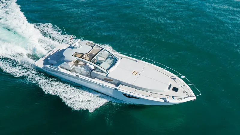 Catch And Release Yacht Photos Pics Luxurious 2017 Triton Custom yacht cruising on clear blue ocean waters.