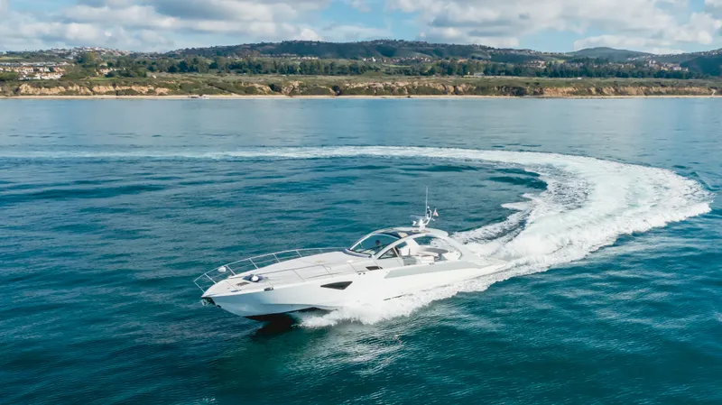 Catch And Release Yacht Photos Pics Luxurious 2017 Triton Custom yacht cruising on open water near scenic coastline.