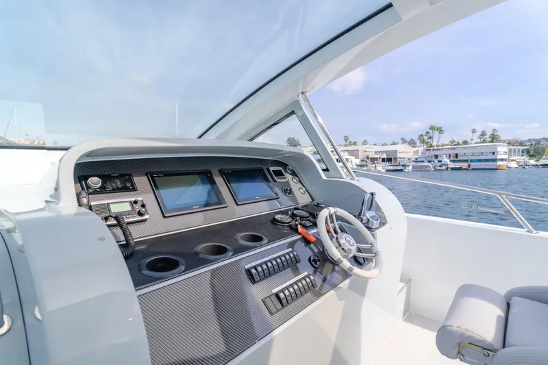 Catch And Release Yacht Photos Pics Cockpit of 2017 Triton Custom boat with modern controls and ocean view.