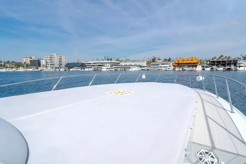 Catch And Release Yacht Photos Pics Triton Custom 2017 yacht deck with marina view, clear sky, and waterfront buildings.