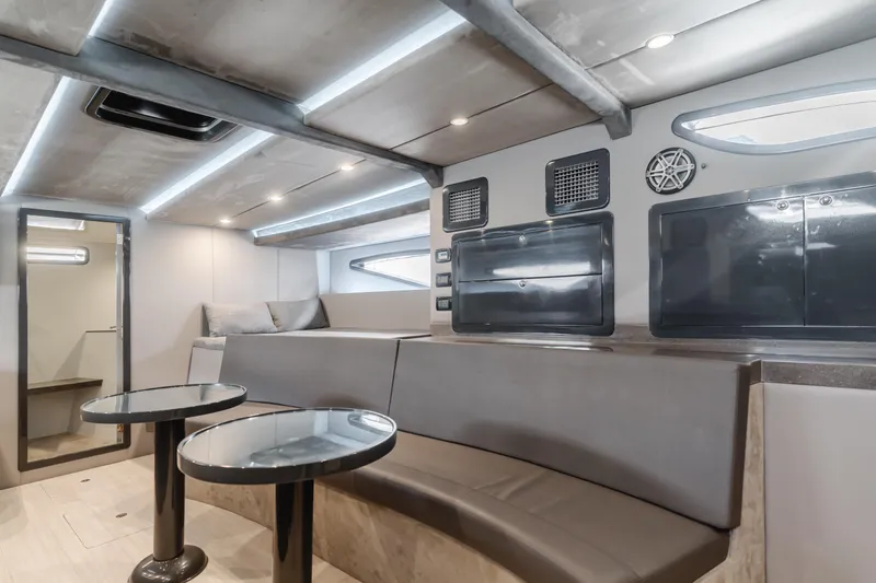 Catch And Release Yacht Photos Pics Modern Triton Custom 2017 yacht interior with sleek seating, tables, and ambient lighting.
