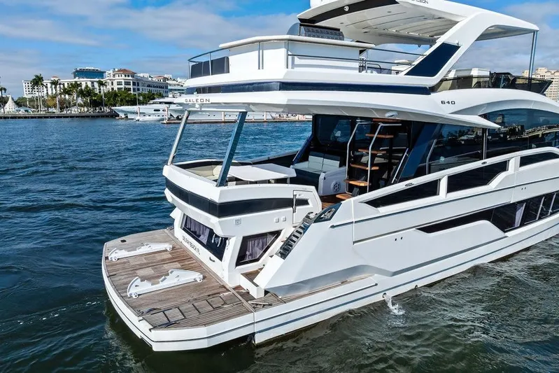  Yacht Photos Pics Luxury 2018 Galeon 640 Fly yacht cruising near a scenic waterfront.