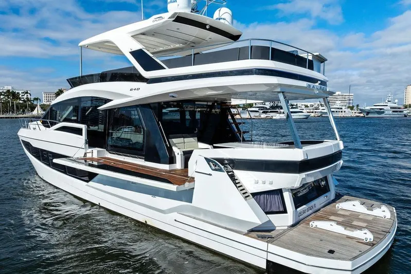  Yacht Photos Pics 2018 Galeon 640 Fly yacht on water, showcasing sleek design and modern features.