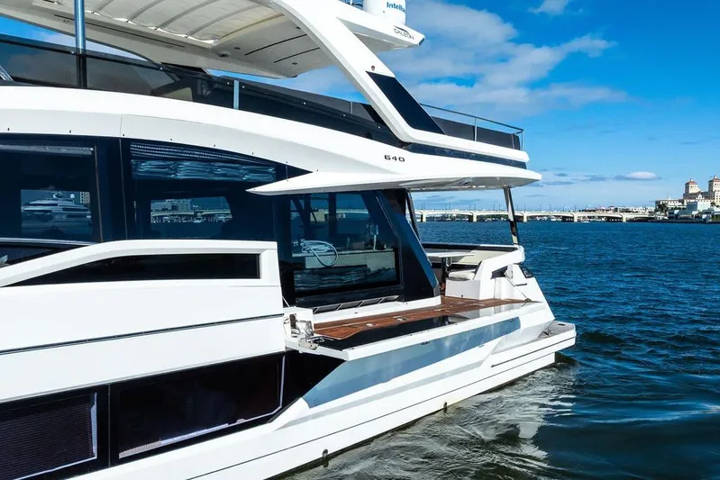  Yacht Photos Pics 2018 Galeon 640 Fly yacht cruising on a sunny day, showcasing sleek design and luxury.