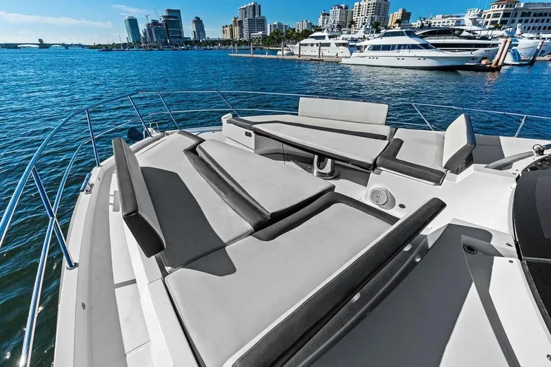  Yacht Photos Pics Luxurious 2018 Galeon 640 Fly yacht with spacious sunbathing area, docked in a marina.