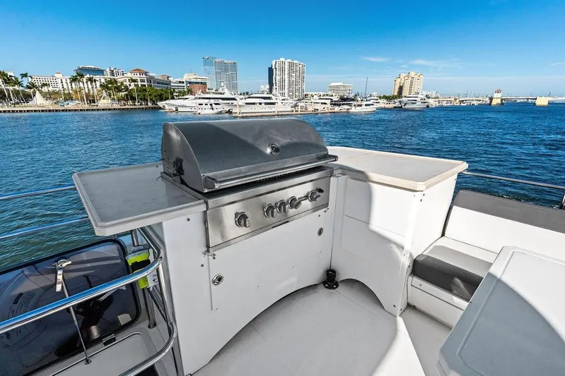  Yacht Photos Pics Outdoor grill on 2018 Galeon 640 Fly yacht with marina view.