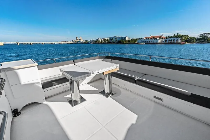  Yacht Photos Pics Luxurious 2018 Galeon 640 Fly yacht deck with seating, overlooking serene waterfront views.