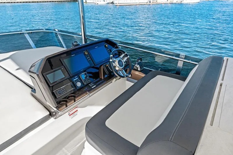  Yacht Photos Pics Cockpit of 2018 Galeon 640 Fly yacht with modern navigation equipment and steering wheel.