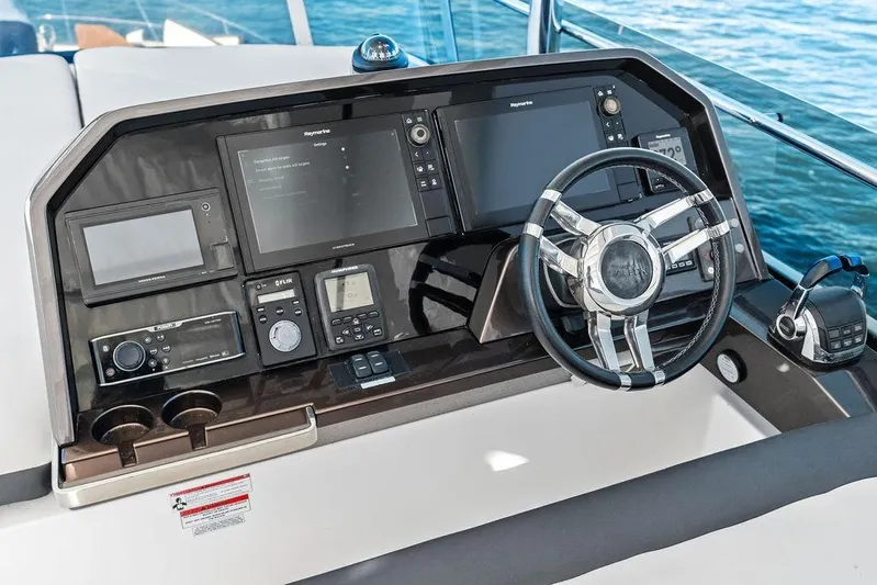  Yacht Photos Pics Helm station of 2018 Galeon 640 Fly yacht with advanced navigation controls.