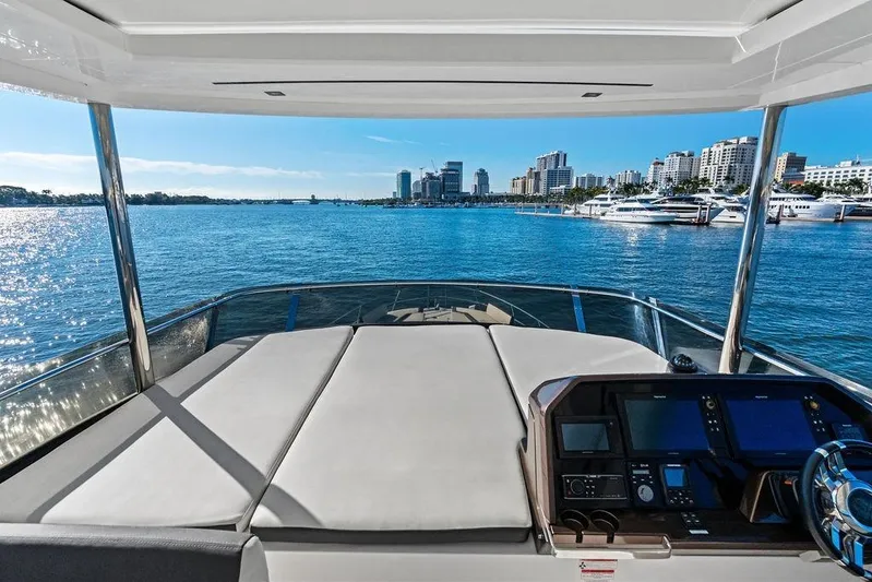  Yacht Photos Pics 2018 Galeon 640 Fly yacht interior with city skyline and marina view.